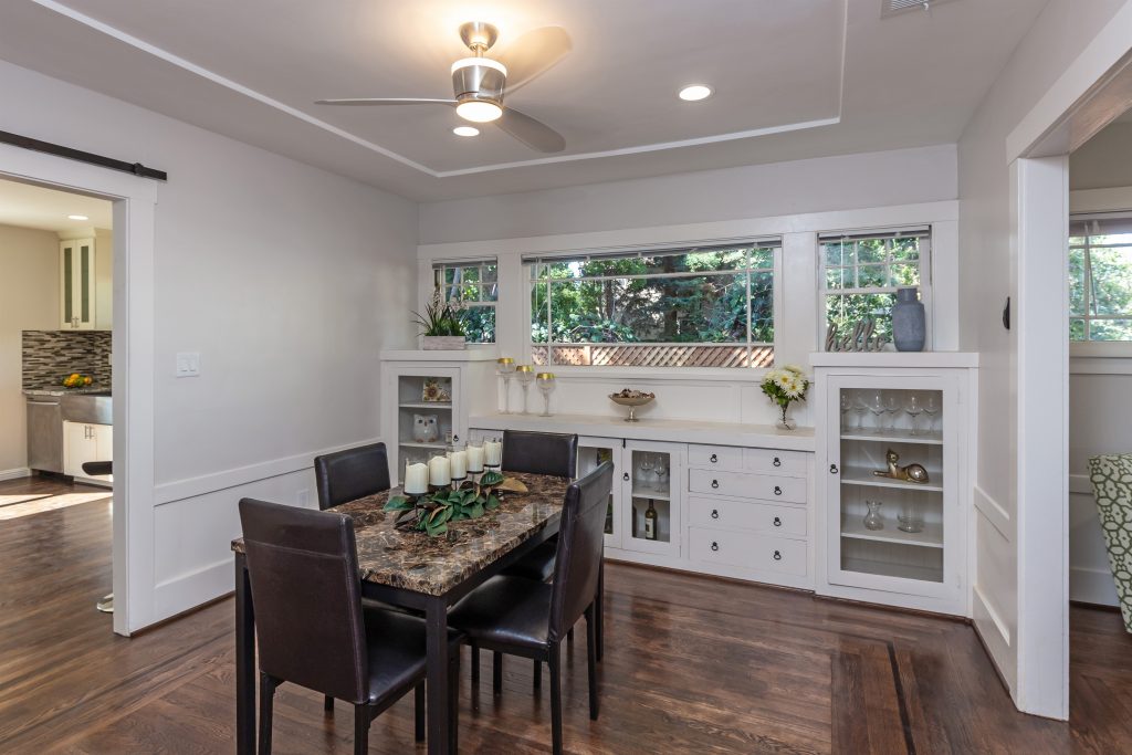 Dining room with white china cabinets